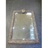 Late Victorian Silver edged bevelled mirror with plain cartouche, embossed flower, leaf and