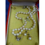Cultured pearl jewellery including single strand necklace with silver clasp, pair of yellow coloured
