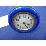Small 1920's travelling timepiece with blue enamel and white coloured metal surround, folding