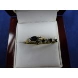 18ct yellow gold ring set with a sapphire and 2 diamonds and a 9ct yellow gold ring set with 3 small