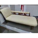 A late Victorian Chaise Longue with cream striped upholstery on turned legs