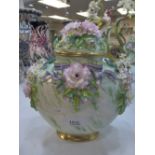 A Lunton porcelain vase and cover with floral encrusted decoration 23cm