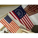 A small U.S A flag and similar larger example with number 76