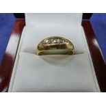 18ct yellow gold ring set with 5 small diamonds, stamped 18ct size R, 4.9g