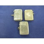 Two Edwardian silver va cases and a 1920's example all with engraved decoration and initials, approx