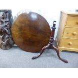 An antique mahogany tripod table having later bird cage support, 80cms