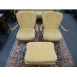 A pair of Ercol stick back open armchairs with one matching stool