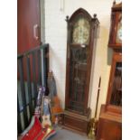 A 1920's mahogany longcase clock having arch top with glazed door, 193cms