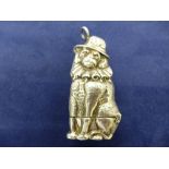 Heavy silver va case modelled as a pug dog wearing a clown collar and feathered hat, stamped925,