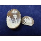 Oval cameo shell brooch carved with landscape and figure in white coloured metal mount signed on the