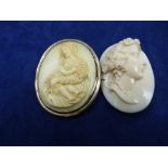 19th Century oval carved ivory brooch depicting Madonna and child, yellow coloured metal mount 6cm