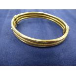 Yellow coloured metal hinged bangle unmarked 10g