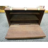 A mahogany box having brass decoration, the interior enclosing shelves