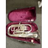 A plated Lafleur Tuba imported by Boosey and Hawkes, in a case