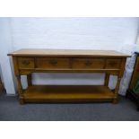 A reproduction oak dresser having four drawers with pot board base, 153cms