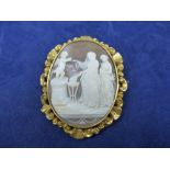 19th Century oval cameo shell brooch carved with classical figures and cherubs in a pinchbeck