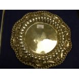 White coloured metal circular plate with embossed 'C' scrol and gadrooned edge, 30.5cm D unmarked