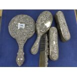 Edwardian silver backed 4 piece dressing table set embossed with cherubs and vines, together with