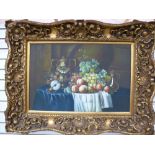 A modern still life picture in an ornate gilt frame