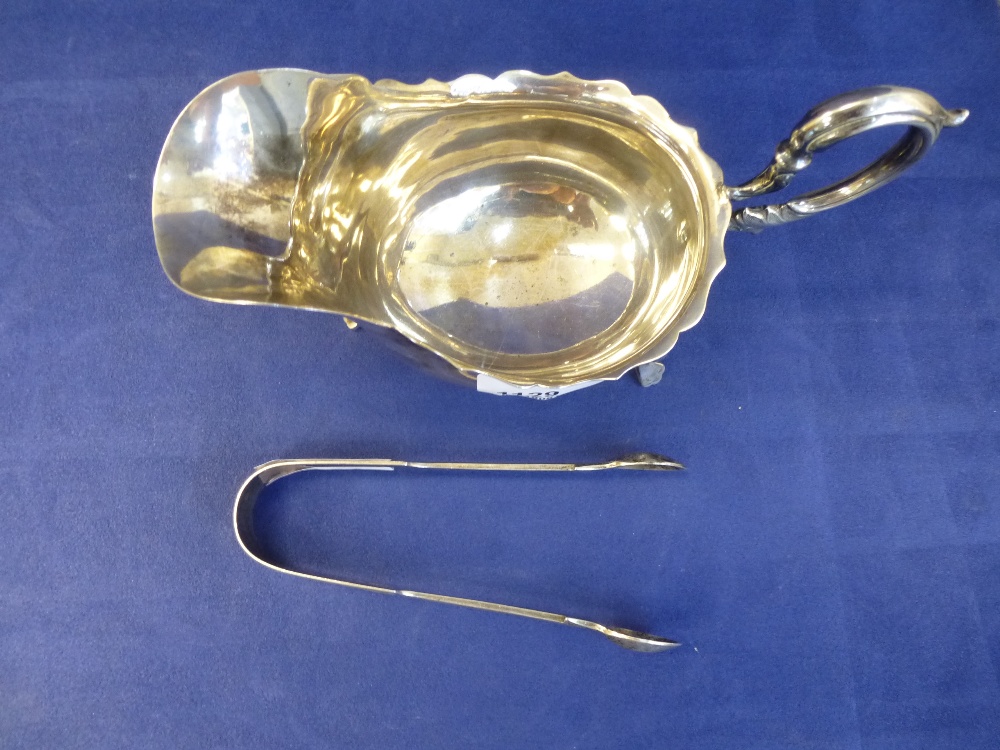 Edwardian silver sauce boat, Birmingham 1908 and a pair of Victorian silver sugar tongs 5.8Toz - Image 3 of 3