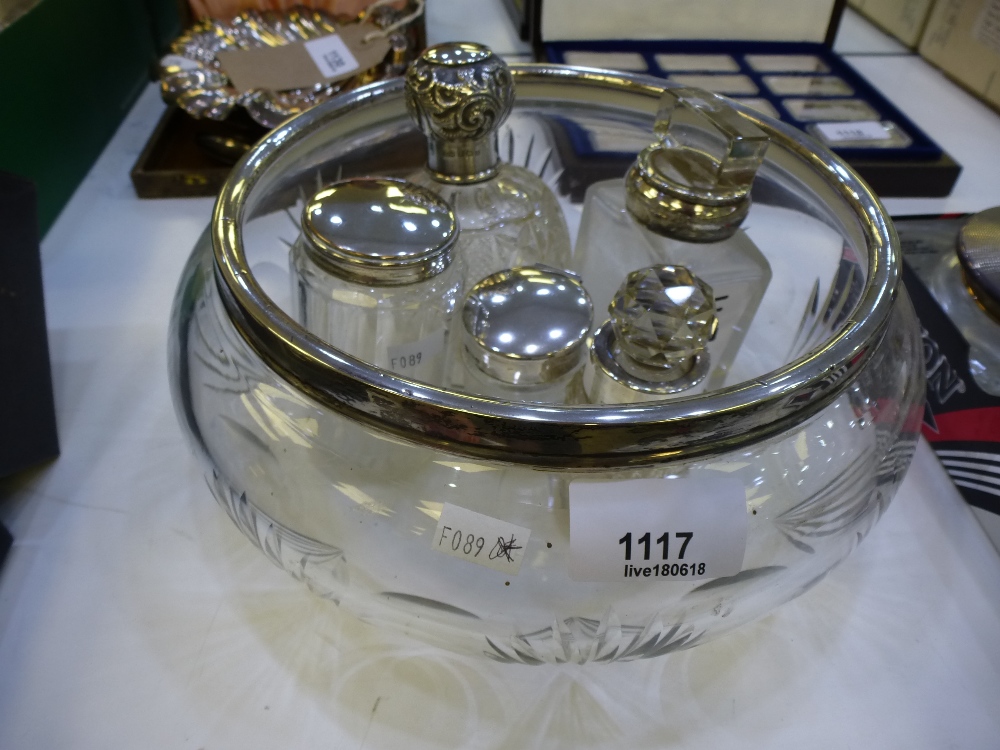 Collection of glass toilet jars some with silver lids and a glass fruit bowel with silver rim