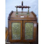 A late Victorian mahogany coal box with brass plaques, decorated with flowers