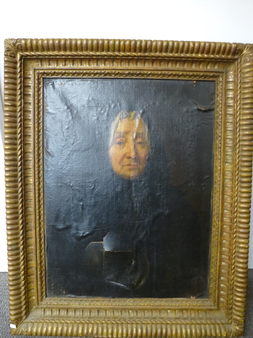 An Antique oil probably early 19th Century portrait of a lady, unsigned 48 x 63.5 cm