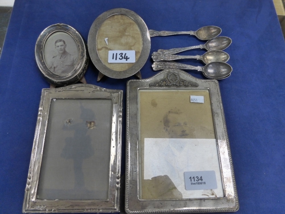 Two rectangular silver fronted photograph frames, the larg 19cm x13cm, Two oval smaller silver
