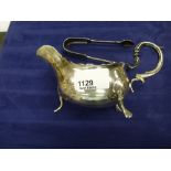 Edwardian silver sauce boat, Birmingham 1908 and a pair of Victorian silver sugar tongs 5.8Toz