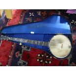 A John Alvery Turner banjo with Mother of Pearl decoration in a case