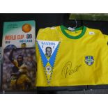 A Brazilian football shirt with Pele signature, a similar photograph and two other items