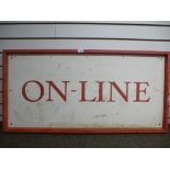 A painted sign with 'On-Line lettering