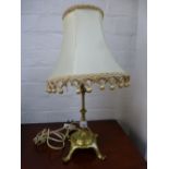 An old Benson style brass lamp with an adjustable top, the leg stamped J.W