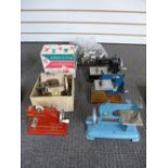 Five versions of Children’s sewing machines to include two Vulcan examples and a bag of buttons