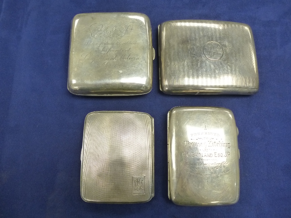 Four silver cigarette cases two with presentation inscriptions, 6 Toz and two with engine turned