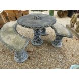 A modern stone effect garden table with tree style pillar and a pair of matching curved benches