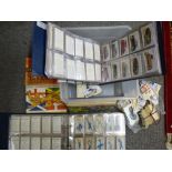 Two albums of old cigarette cards and sundry loose cigarette and tea cards