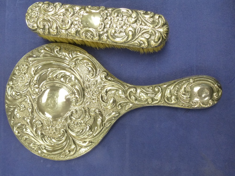 Edwardian Silver backed hand mirror with embossed decoration, Birmingham 1908 and matching clothes - Image 2 of 2