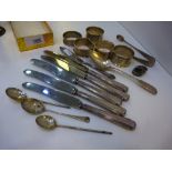 Collection of silver including 5 serviette rings, sugar tongs, cutlery etc. approx 5 troy oz