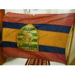 An old flag with Wiltshire cr, decorated bird, A/F, 128 x 94cms