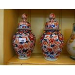 A pair of Japanese Imari ginger jars and covers