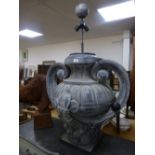 A large tin metal two handled urn shaped lamp