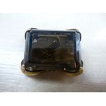 Rectangular smokey quartz pendant/brooch in a yellow coloured metal mount, unmarked 3x2cm