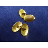 Pair of plain oval 9ct yellow gold cufflinks, stamped 375 6.3g