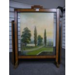 An Art Deco fire screen with painted panel of a garden scene, 69 cms