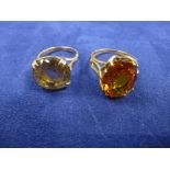 Two 19701's citrine set dress rings on gold shanks, one stamped 9ct size N&R