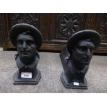 Pair of cast iron firedogs decorated man with hat