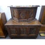 A 17th century and later carved oak cabinet on coffer style panelled base 126cms