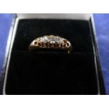 18ct Edwardian yellow gold ring set with 4 small brilliant cut diamonds, stamped 18, one diamond