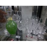 A shelf of sundry glassware to include two jugs and seven tumblers